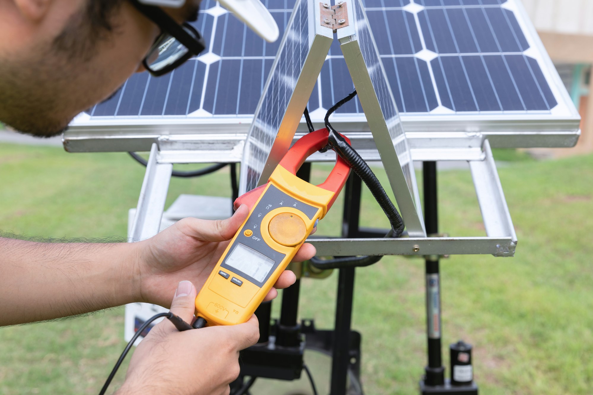 Engineer with energy measurement tool photovoltaic modules for renewable energy